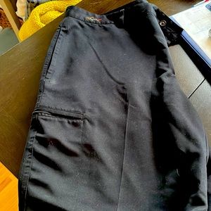 Greg Norman flat front black pants, with side zipper for phone pocket.